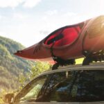 Kayak Securely Tied to Car Roof Rack for Safe Transportation